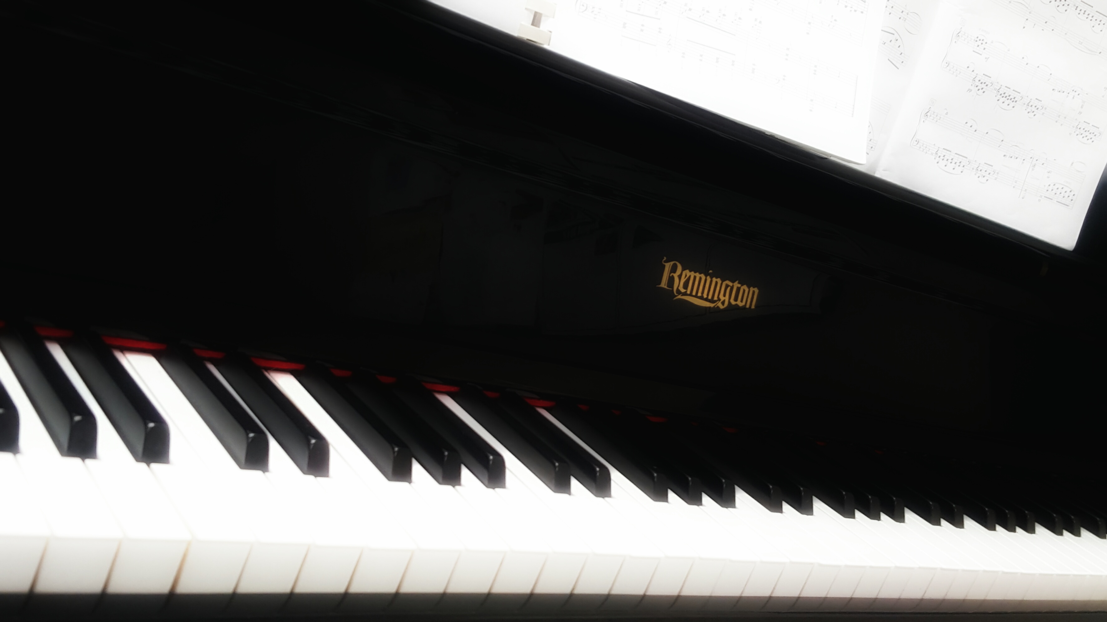 angled image of a piano keyboard